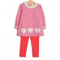 This set features a red mini gingham print, a ruffle collar, and floral heart appliques. Coordinating red leggings to match