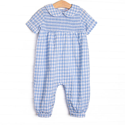 This romper features a blue gingham print, peter pan collar, and elastic smocking across the chest!