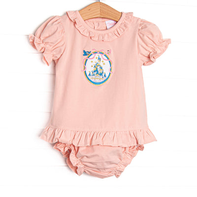  This set features a pink knit material, a framed castle embroidery, and ruffle trim. Coordinating diaper cover to match. 