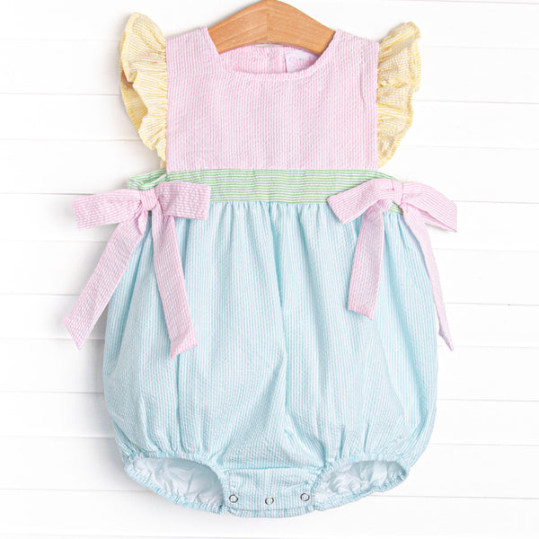  This bubble features precious pastel seersuckers, flutter sleeves, and bows on the sides. 