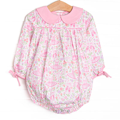 This bubble features pink ballerina printed fabric, a pink Peter Pan collar, and long sleeves. 