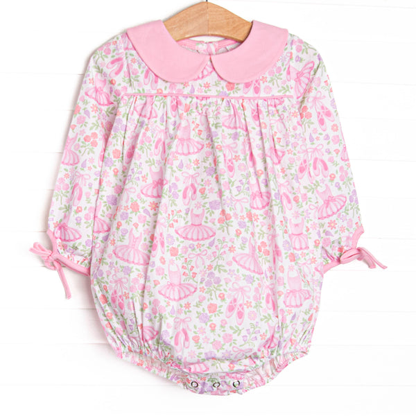 This bubble features pink ballerina printed fabric, a pink Peter Pan collar, and long sleeves. 