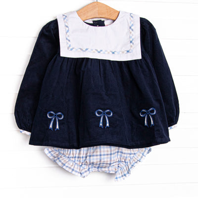  This set features navy corduroy material, a bib with blue plaid trim, and blue bow appliques. Coordinating blue plaid diaper cover to match. 