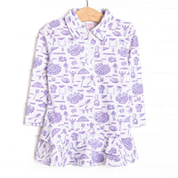 This tennis dress features a purple football themed print, a ruffle layered bottom, and the best performance fabric