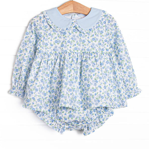 This set features a blue floral print, a peter pan collar with ruffle trim. and coordinating blue floral diaper cover.v
