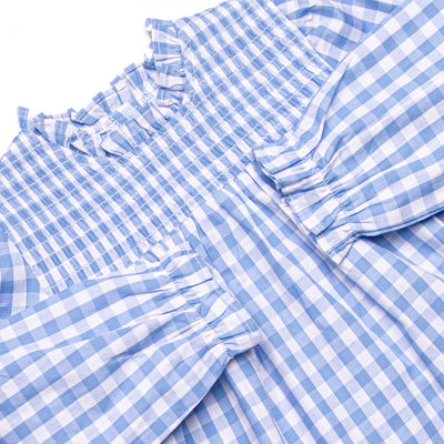 This set features a smocking across the top, a blue check print, and matching diaper cover.