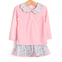  This set features a pink floral print, a floral ruffle collar, and the best performance fabric. 