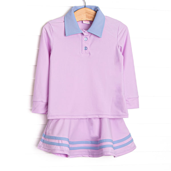 This set features a purple material, a blue collar, the best performance fabric, and a coordinating skort.