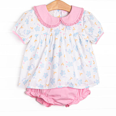 This set features a blue floral print, a pink eyelet lace trimmed collar, and short puff sleeves. Coordinating pink diaper cover to match.