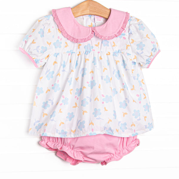 This set features a blue floral print, a pink eyelet lace trimmed collar, and short puff sleeves. Coordinating pink diaper cover to match.