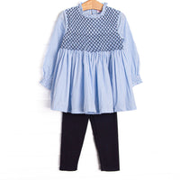  This set features blue gingham fabric, navy smocking, and long sleeves. Coordinating navy leggings to match. 