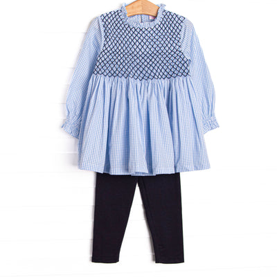  This set features blue gingham fabric, navy smocking, and long sleeves. Coordinating navy leggings to match. 