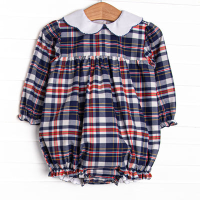 This bubble features a navy and red plaid fabric, a scalloped collar, and long sleeves.