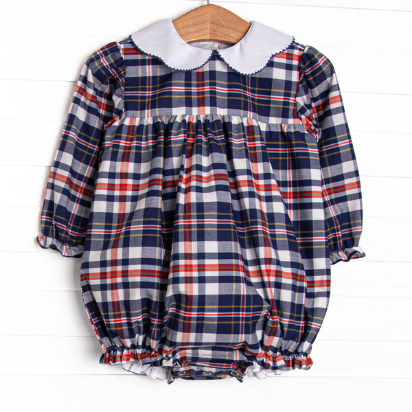 This bubble features a navy and red plaid fabric, a scalloped collar, and long sleeves.