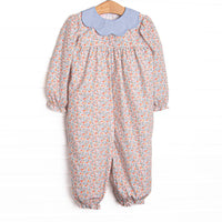 This romper features a floral print, a blue scalloped collar, and long sleeves.