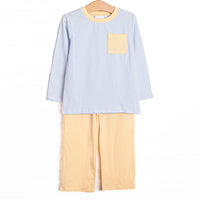  The set features light blue striped soft knit material, a yellow front pocket, and coordinating yellow pants. 