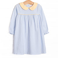 This dress features a light blue stripes, soft knit material, and a yellow peter pan collar.