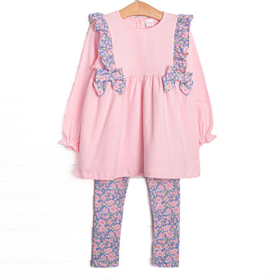 This set features a pink top with purple floral ruffles and side ties. Coordinating purple floral leggings to match.