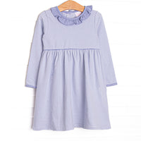 This dress features Periwinkle&nbsp; stripes, front pockets, and ruffle trim.