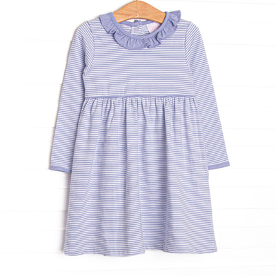 This dress features Periwinkle&nbsp; stripes, front pockets, and ruffle trim.