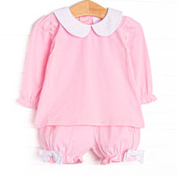 This set features pink knit fabric, bitty dot bows, and a white peter pan collar. Coordinating pink bloomer shorts to match.