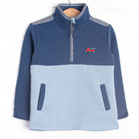  This pullover features navy and light blue fleece fabric, a zip up collar, and firetruck embroidery. 