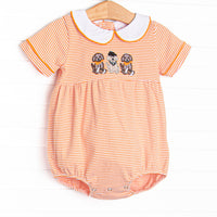 This bubble features orange striped knit material, puppy football applique, and a white peter pan collar.
