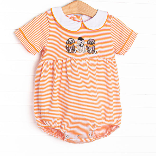 This bubble features orange striped knit material, puppy football applique, and a white peter pan collar.