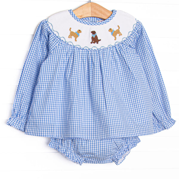 This set features blue gingham fabric, golden retriever trio smocking, and long sleeves. Coordinating blue gingham diaper cover to match.