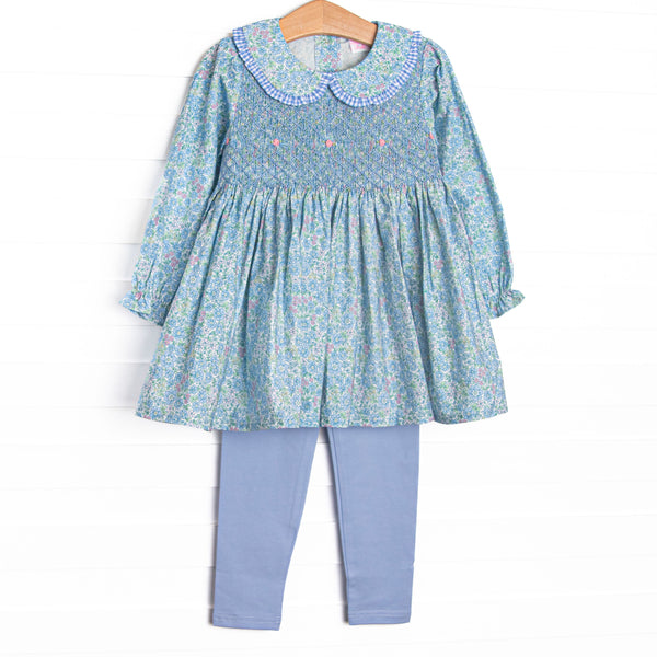 This set features a blue floral print, floral smocking, and a Peter Pan collar. Coordinating blue leggings to match.