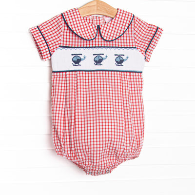  This bubble features red windowpane fabric, helicopter smocking, and a navy blue trimmed Peter Pan collar. 