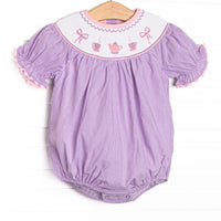 This bubble features a purple gingham print, puff sleeves, and a tea party.
