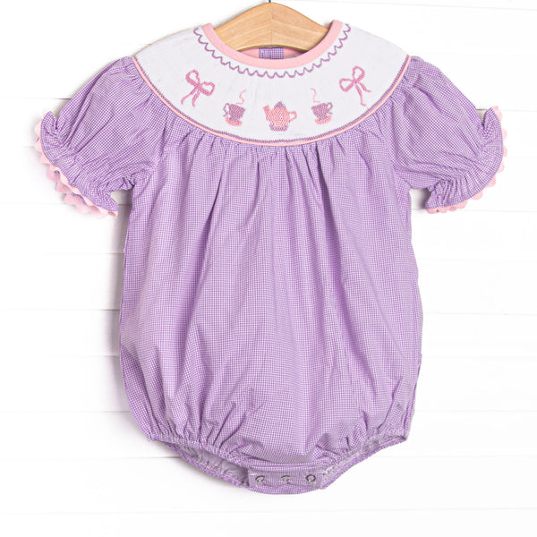 This bubble features a purple gingham print, puff sleeves, and a tea party.