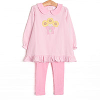 This set features pink striped knit fabric, sunflower applique, a pink Peter Pan collar, and long sleeves. Coordinating pink leggings to match.