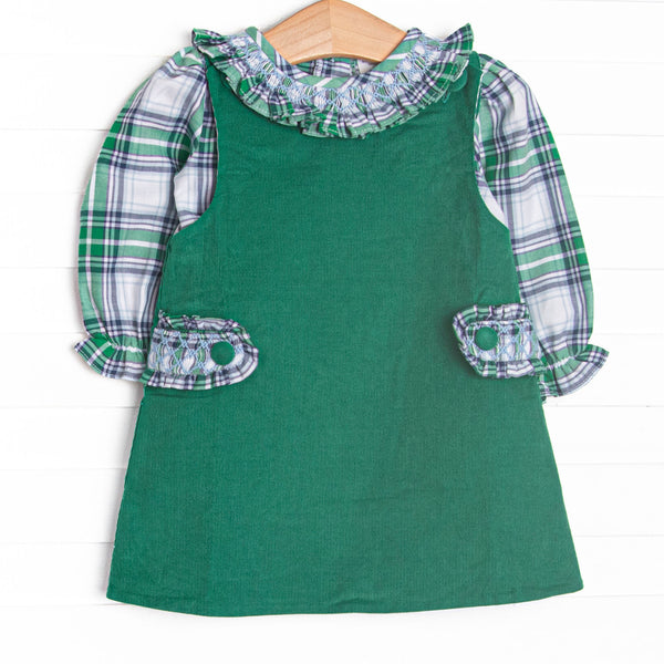 This dress set&nbsp; features a blue plaid top with a ruffle collar and a green corduroy jumper dress with ruffle button-on tabs.