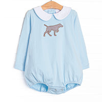 This bubble features a light blue knit material, a Peter Pan collar, and a puppy applique.