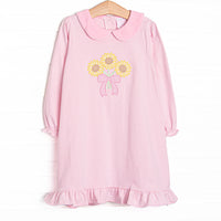 This dress features pink striped knit fabric, sunflower applique, a pink Peter Pan collar, and long sleeves.