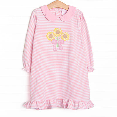 This dress features pink striped knit fabric, sunflower applique, a pink Peter Pan collar, and long sleeves.