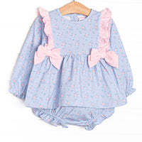  This set features a long sleeve blue floral print, pink ruffle trim, and pink bows. Matching diaper cover to complete the set. 