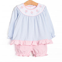  This set features blue knit stripes, floral applique, and a white bib collar. Coordinating pink bloomers to match. 