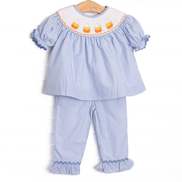 This set features blue striped fabric, candy cane smocking, and short puff sleeves. Coordinating ruffle pants to match.