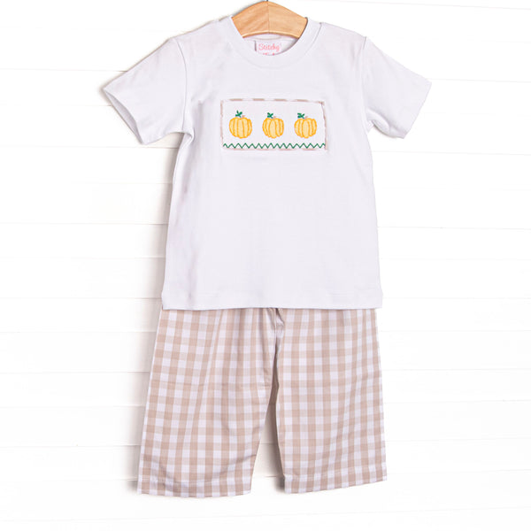 This set features a short sleeve top with a trio of pumpkin smocking and tan check pants to match.