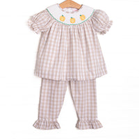  This set features a tan check print, a trio of pumpkin smocking, and puff sleeves. Matching tan check ruffle pants to complete the set. 