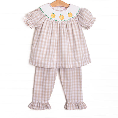  This set features a tan check print, a trio of pumpkin smocking, and puff sleeves. Matching tan check ruffle pants to complete the set. 
