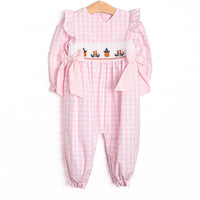  This romper features pink gingham fabric, Halloween smocking, and pink side ties. 
