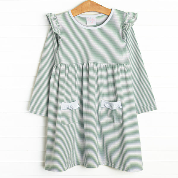 The dress features front ruffle pockets, white ruffle&nbsp; trim, and soft knit material.