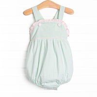 This bubble features a green gingham print, pink gingham ruffle trim, and snaps on the stride.