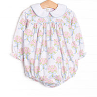 This bubble features white knit fabric, pink rose print, and a white Peter Pan collar.