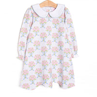  This dress features white knit fabric, pink rose print, and a white Peter Pan collar. 