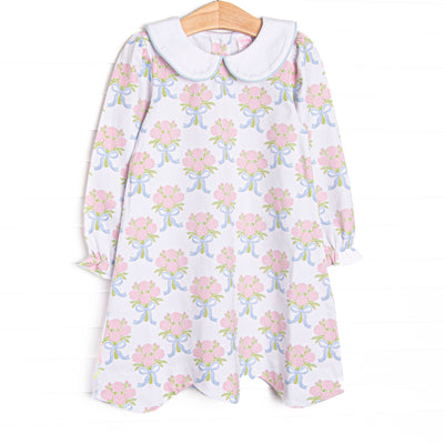  This dress features white knit fabric, pink rose print, and a white Peter Pan collar. 